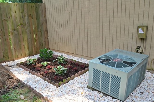 air-conditioner-on-gravel-with-garden